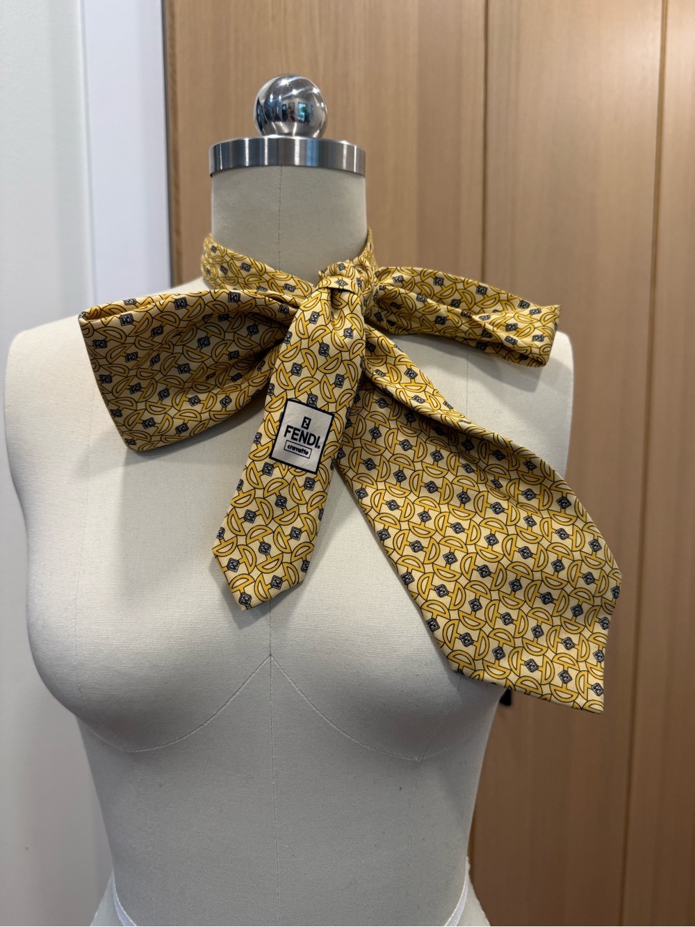 Fendi men’s yellow silk logo neck scarf.